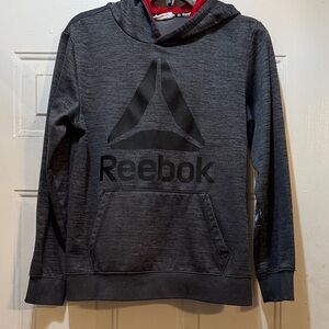 Reebok Charcoal Hoodie with Black Logo. Only issue is paint on left arm